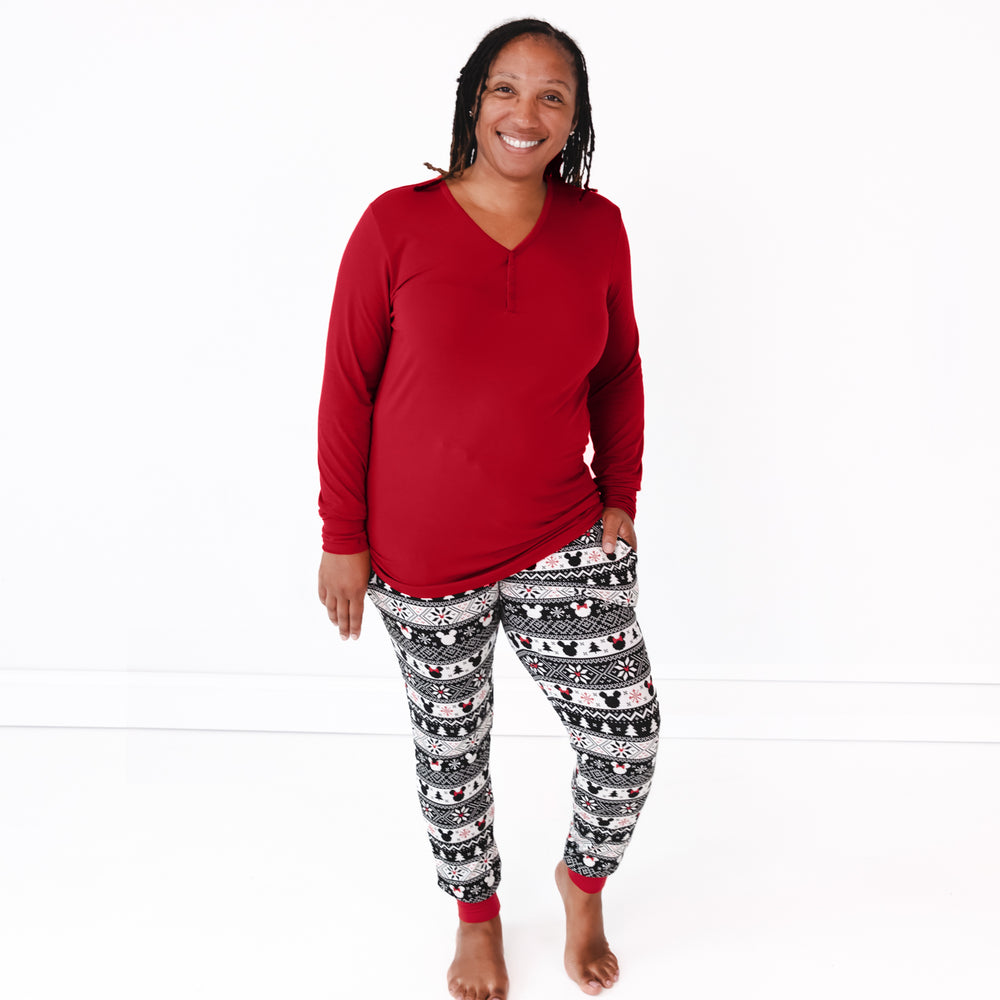 image of a woman wearing women's Mickey Fair Isle pj pants and women's holiday red pj top