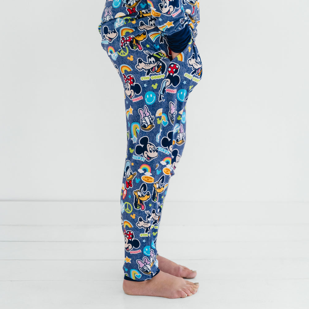 Side view of a woman wearing the Navy Disney Mickey's Clubhouse bamboo pajama pants 