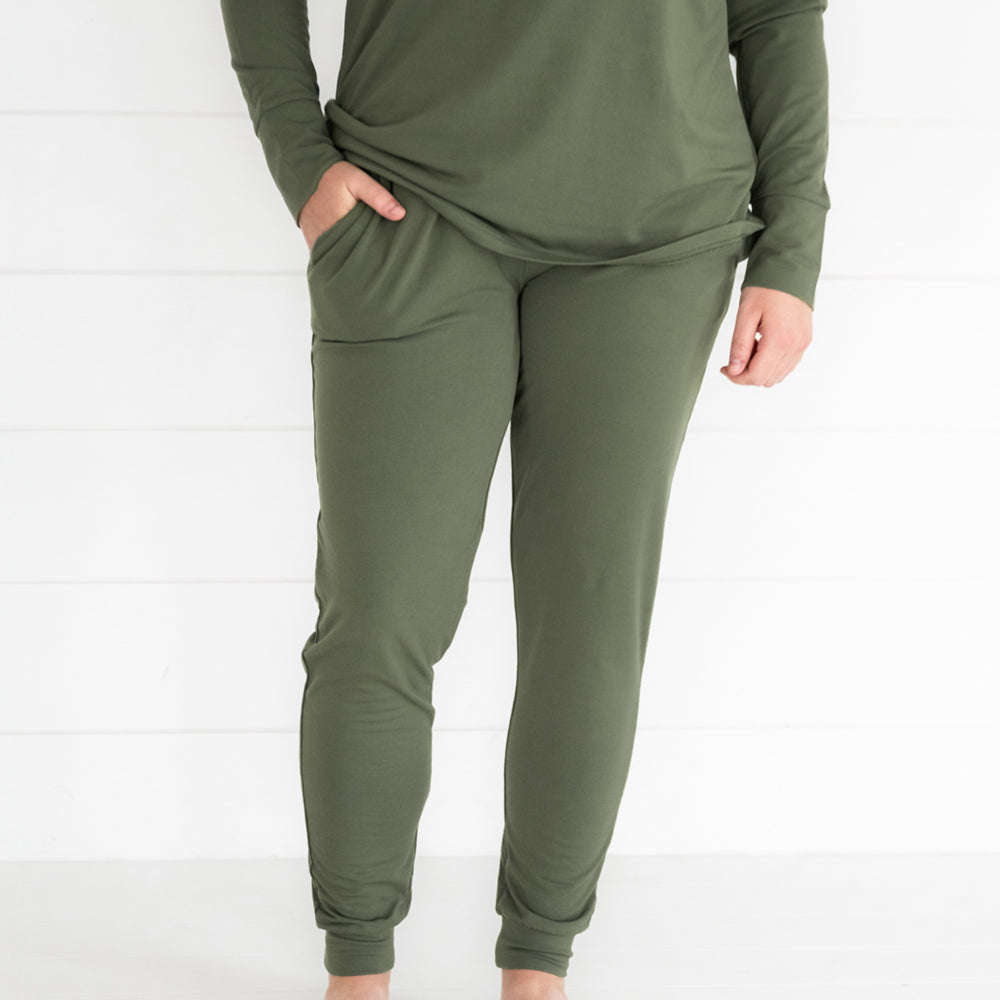 Close up image of a woman wearing Cozy Olive women's pj pants