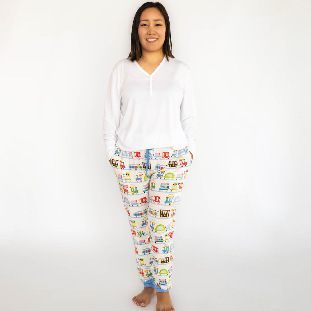 woman wearing a women's bright white pj top paired with Education Express printed women's pj pants