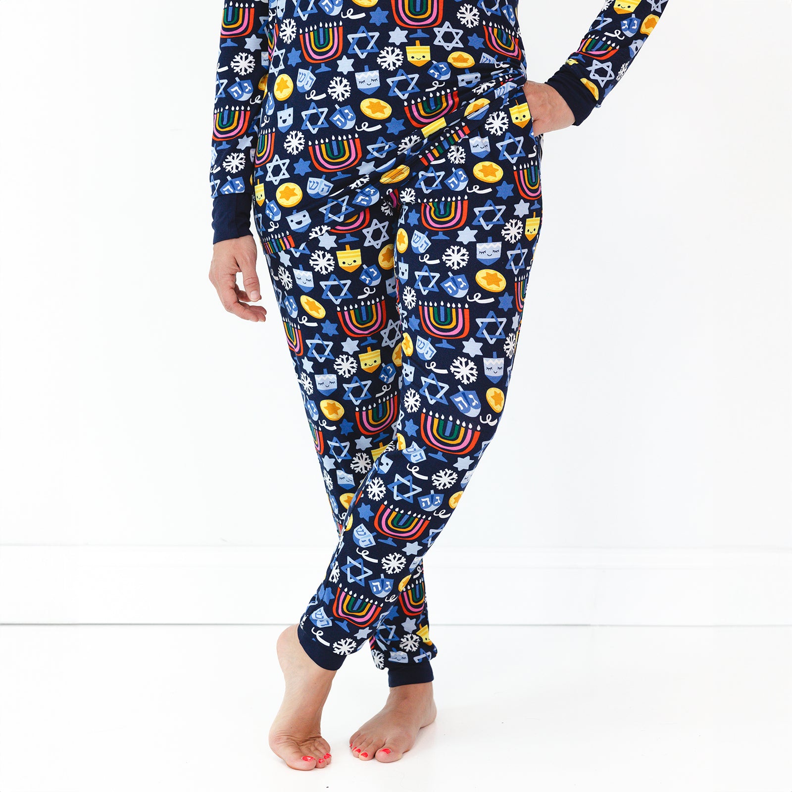 Close up image of a woman wearing Playful Dreidels Women's Pajama Pants and Top