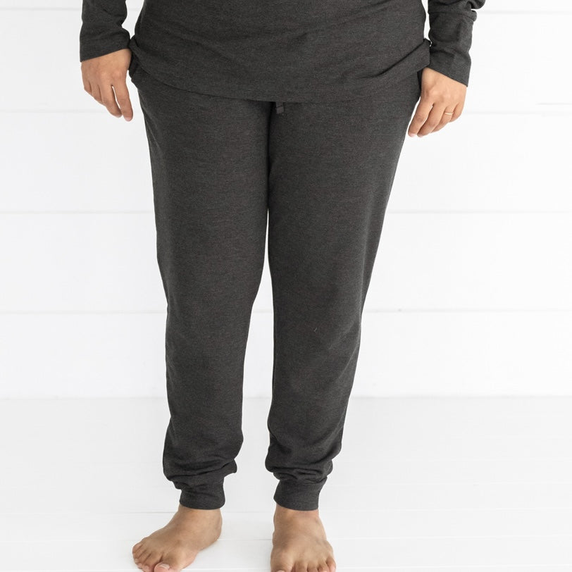 Close up image of a woman wearing Women's Cozy Heather Black pj pants