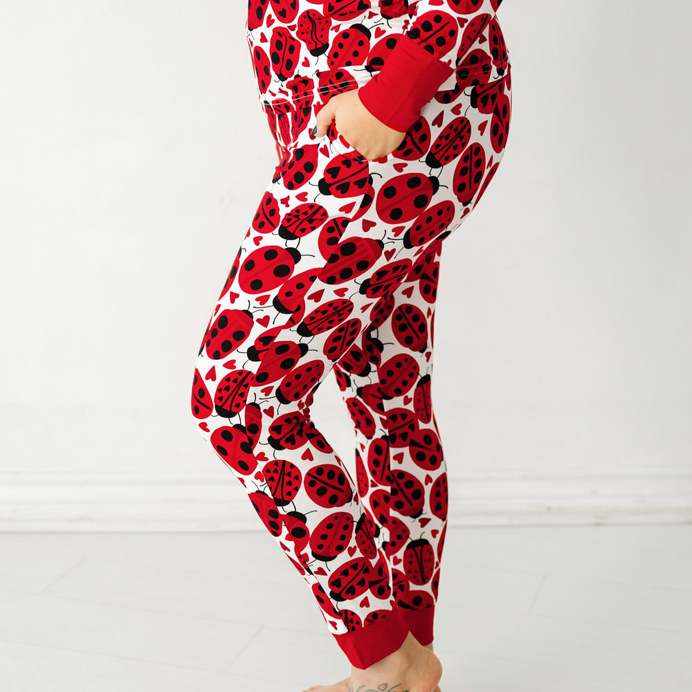 Click to see full screen - Close up side view image of a woman wearing Love Bug printed women's pajama pants