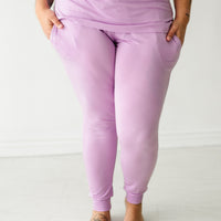 Close up image of a woman wearing Light Orchid women's pajama pants