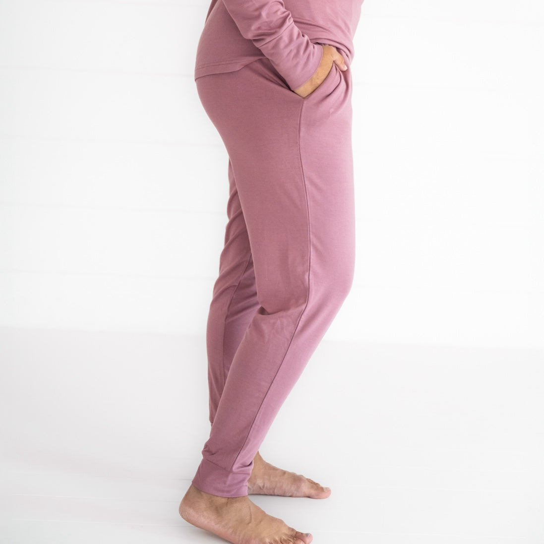 Close up image of a woman wearing women's Cozy Dusty Plum pj pants