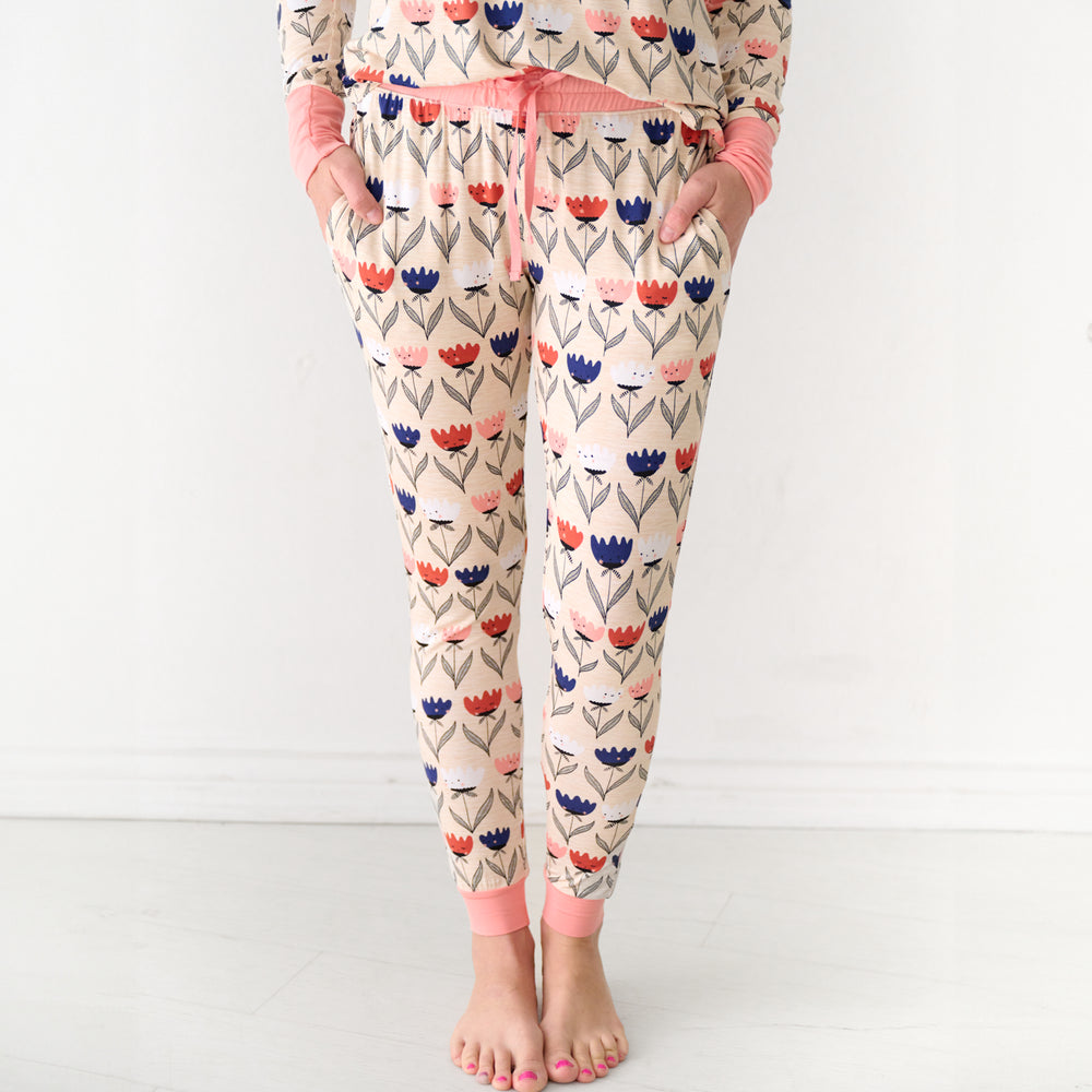 Close up image of a woman wearing Flower Friends women's pajama pants