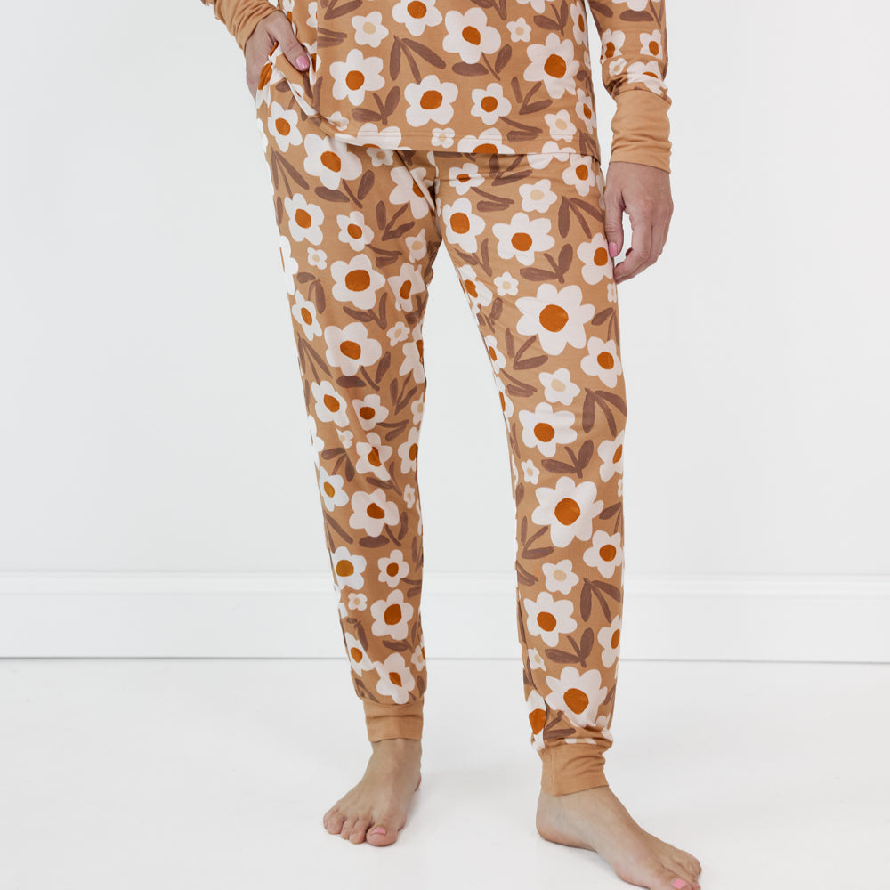 Close up image of a woman wearing women's Daisy Daydream pajama pants