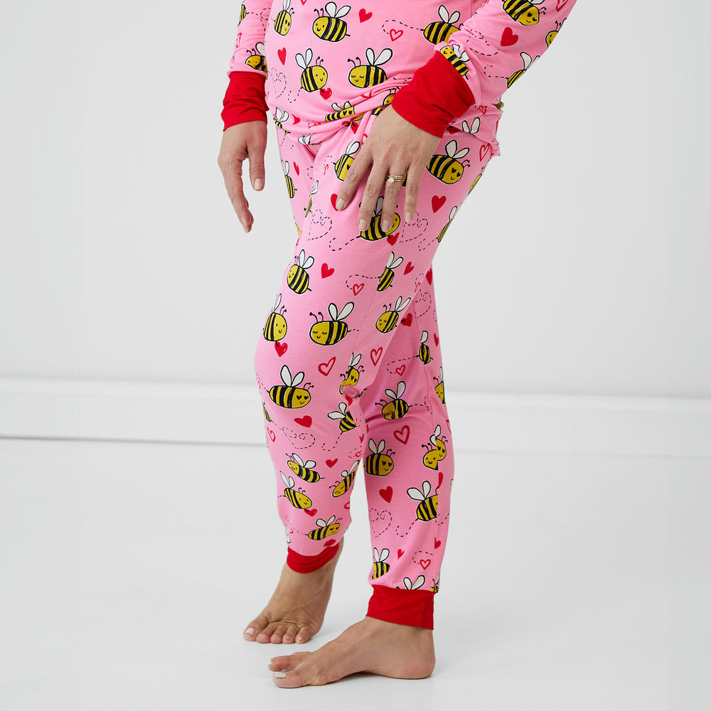 Close up image of a woman wearing Pink Bee Mine pj pants