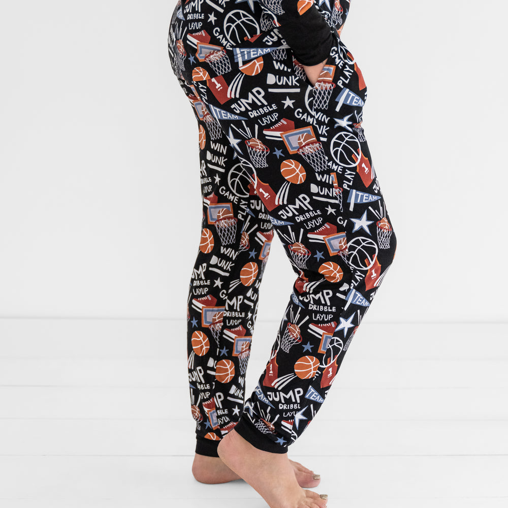 Side view of a woman wearing the Black Slam Dunk bamboo pajama pants