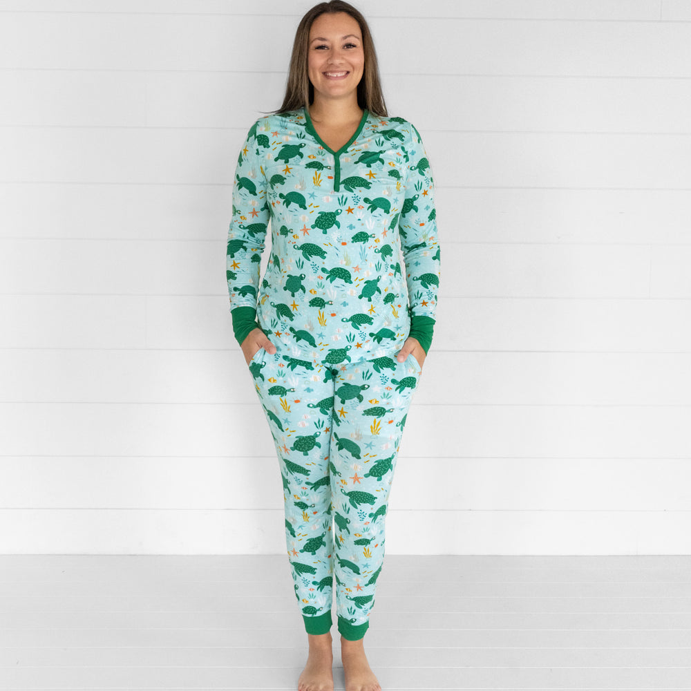 Image of a woman wearing women's Sea Turtle Friends women's pj top and women's pj pants