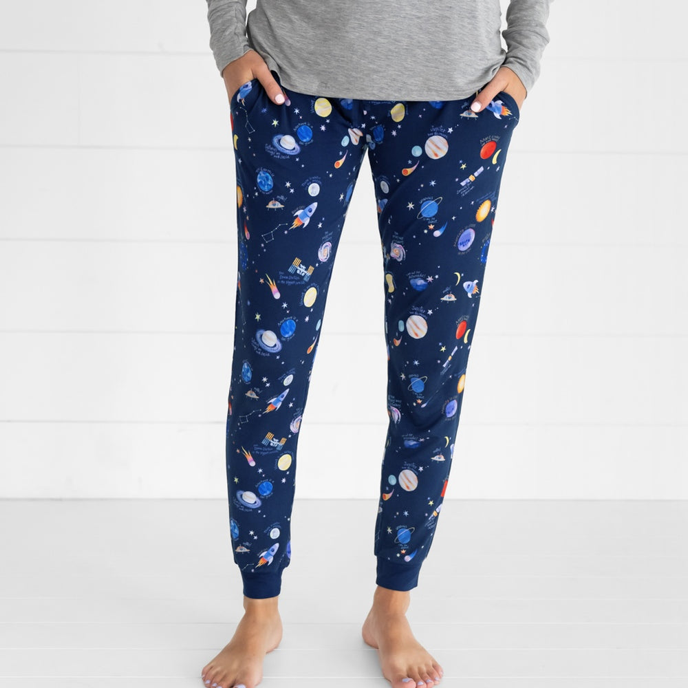 Close up image of a woman wearing a pair of Through My Telescope women's pj pants