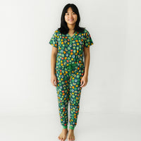 Woman wearing a Lucky printed women's pajama top and matching pajama pants