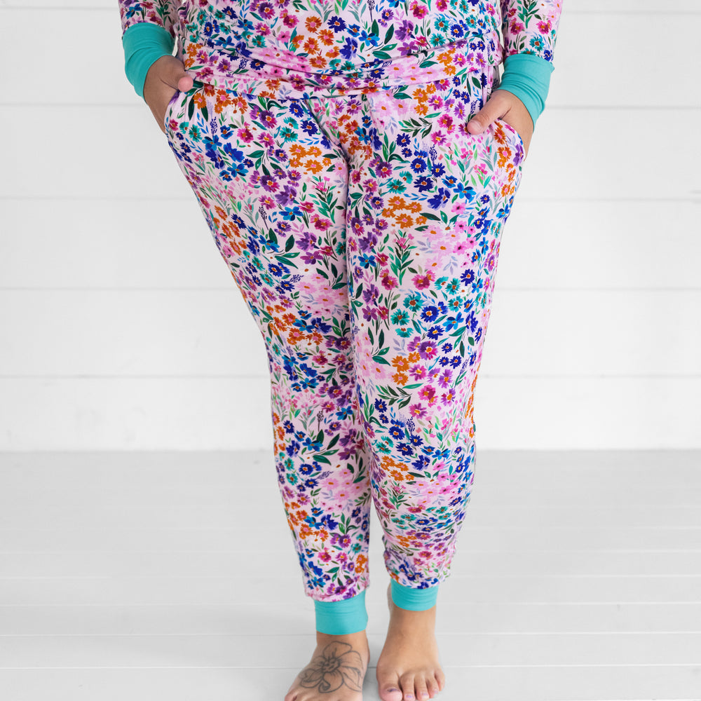 Close up image of a woman wearing Sweet Pea Floral women's pj pants