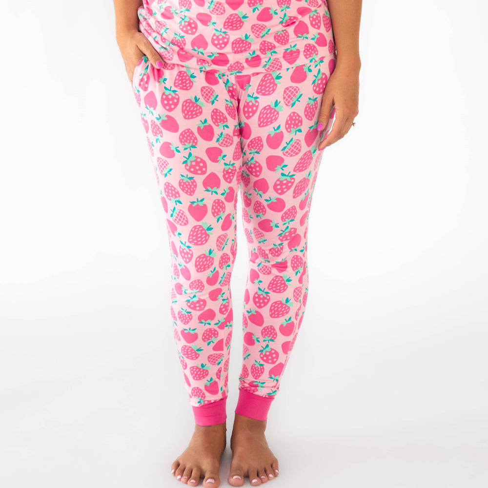 Woman wearing the Sweet Strawberries Women's Pajama Pants, with hand in the pocket