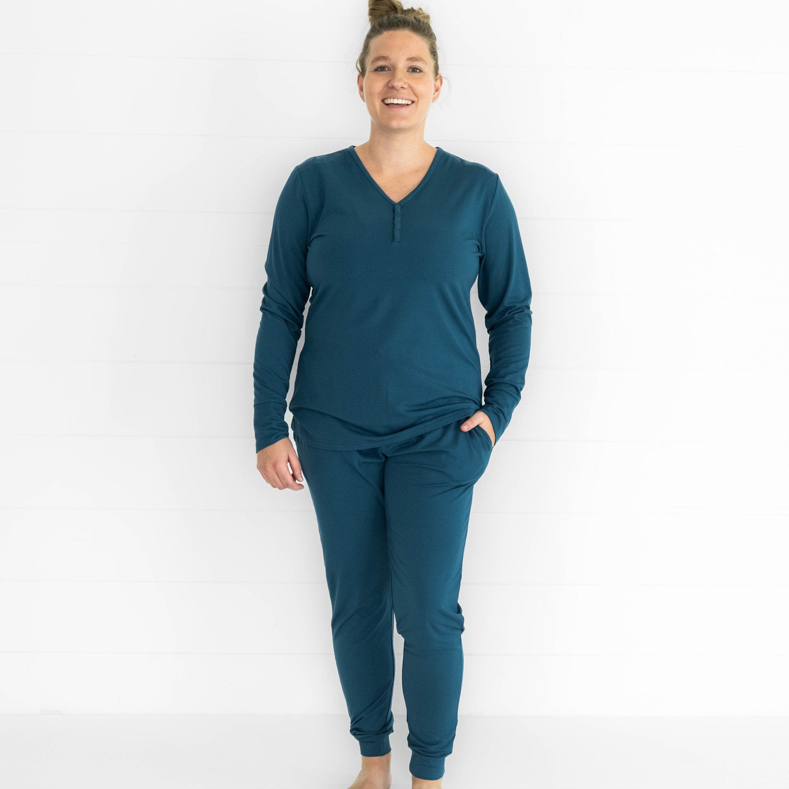 image of a woman wearing a Cozy Twilight Teal pj top and matching women's pants