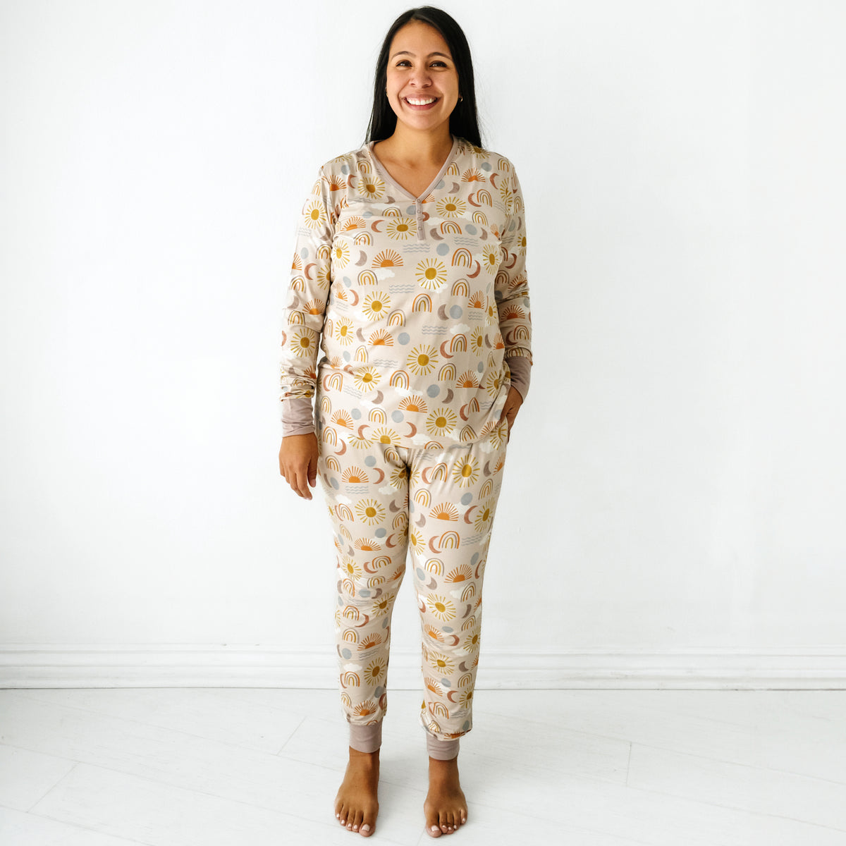 Woman wearing a Desert Sunrise women's pajama top paired with matching women's pajama pants