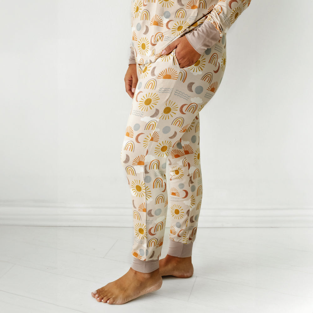 Click to see full screen - Alternate profile view of a woman wearing Desert Sunrise women's pj pants with her hands in her pockets