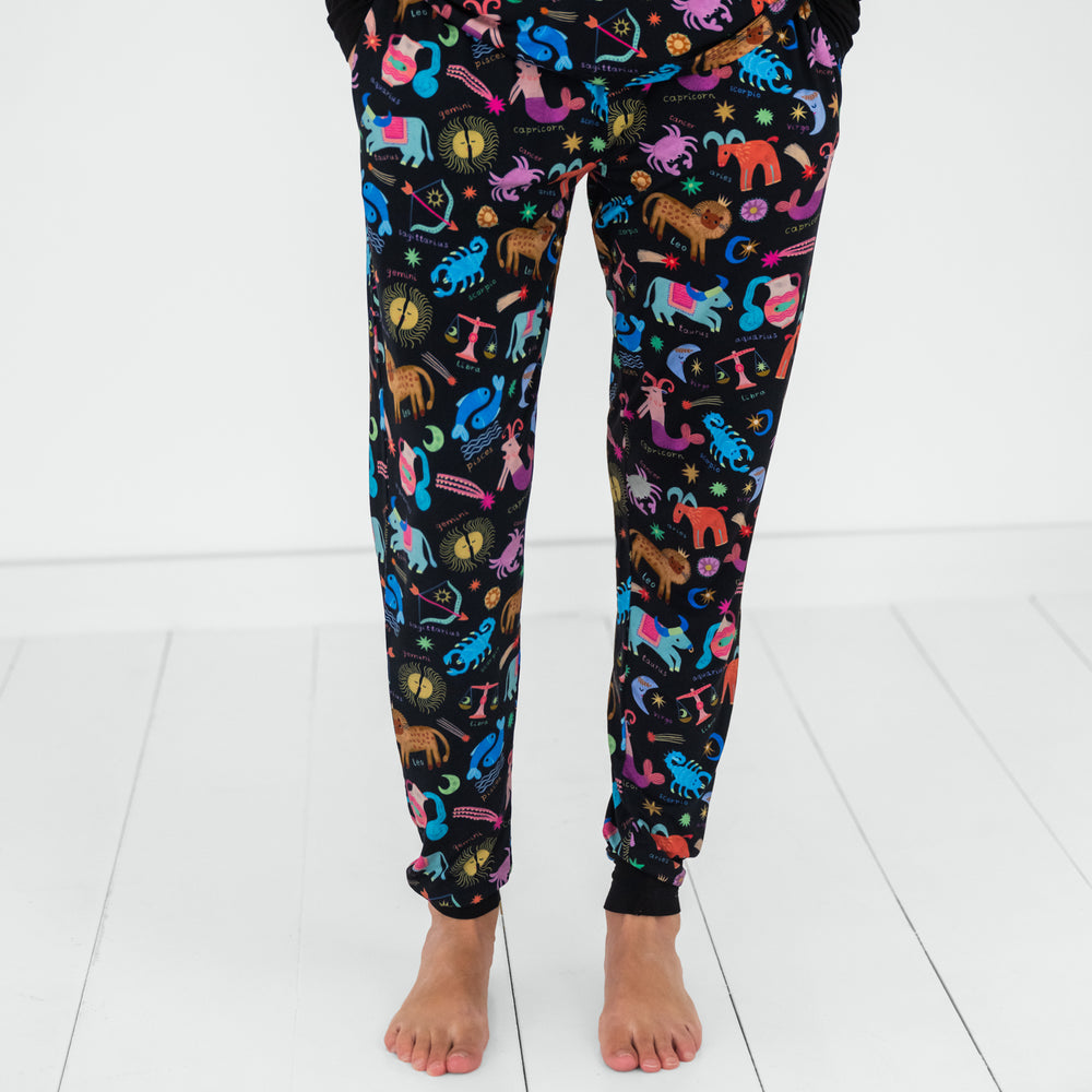 Close up image of a woman wearing Star Signs women's pj pants