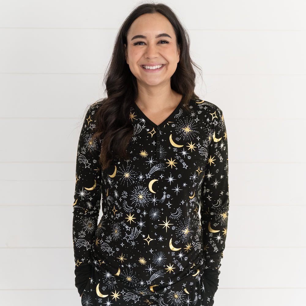 Close up image of a woman wearing a Celebration Stars women's pj top