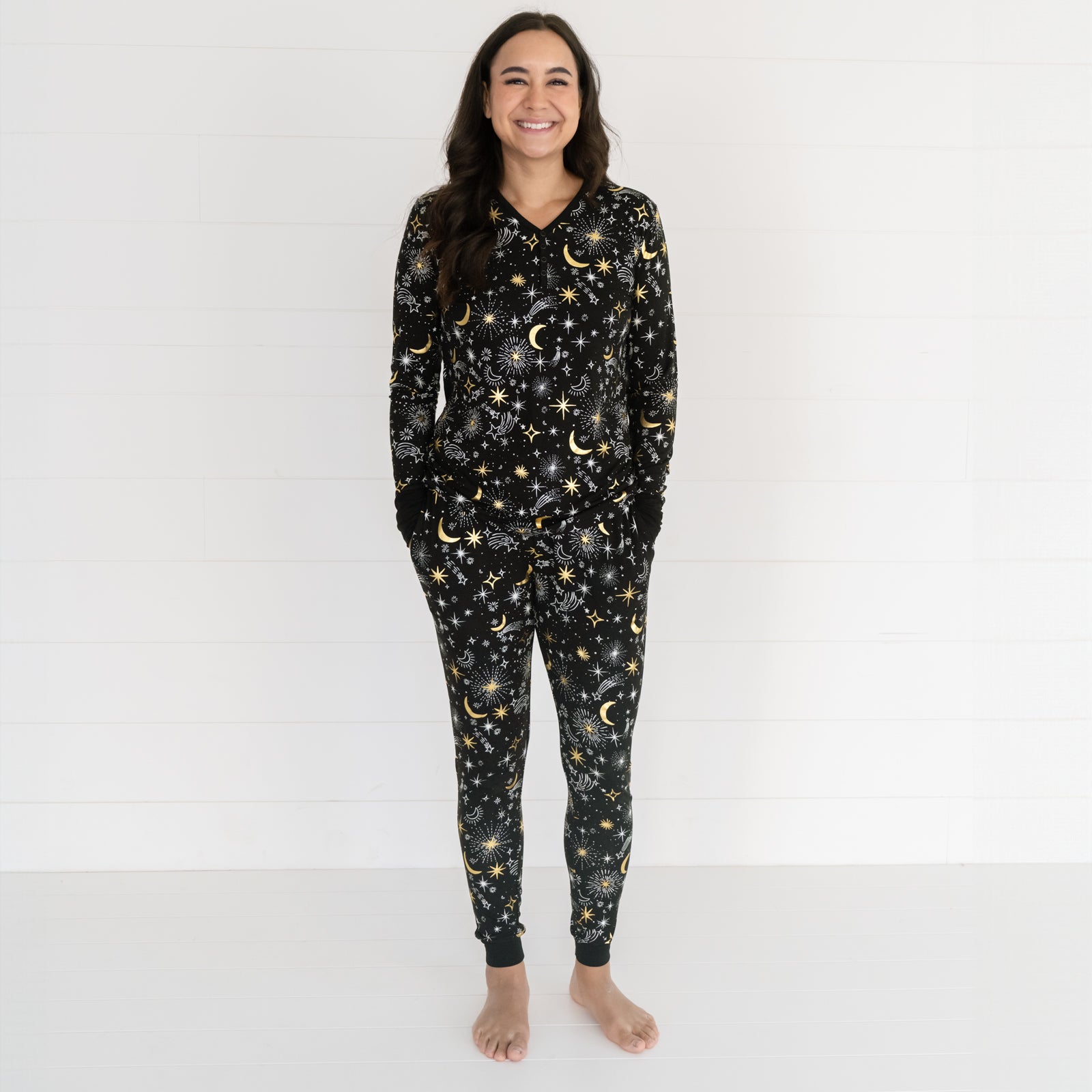 Image of a woman wearing Celebration Stars printed women's pj top and matching women's pj pants