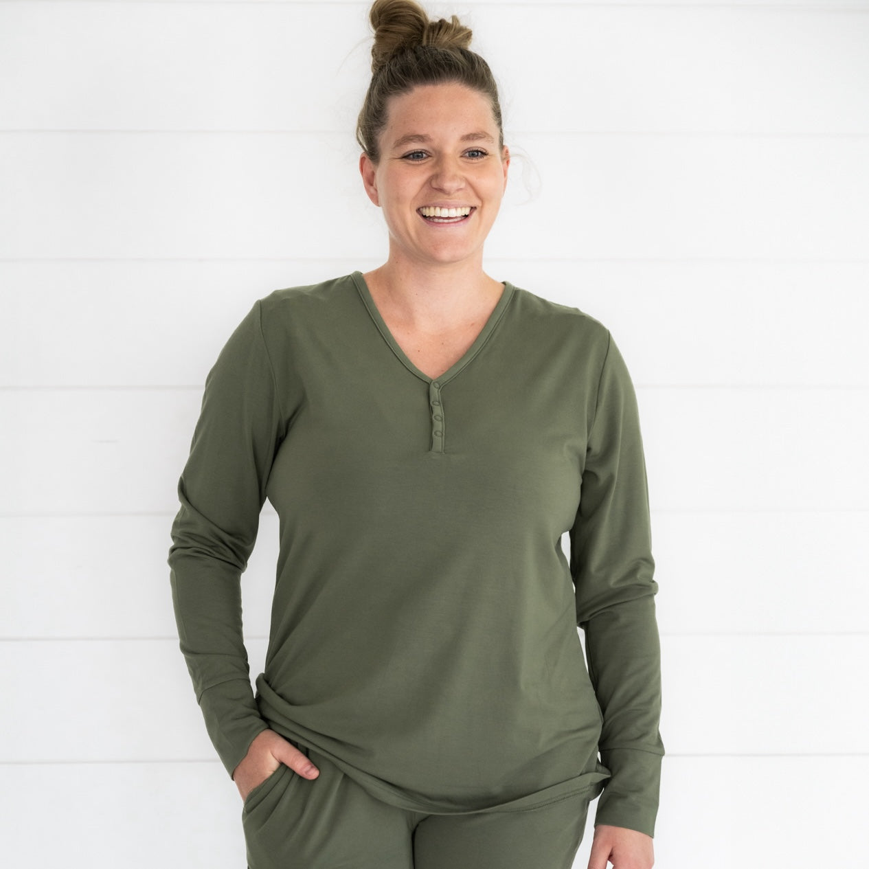 Close up image of a woman wearing Cozy Olive women's pj top