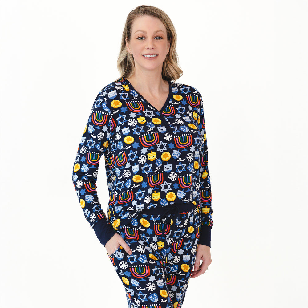 Woman wearing a Playful Dreidels Women's Pajama Top and Pants