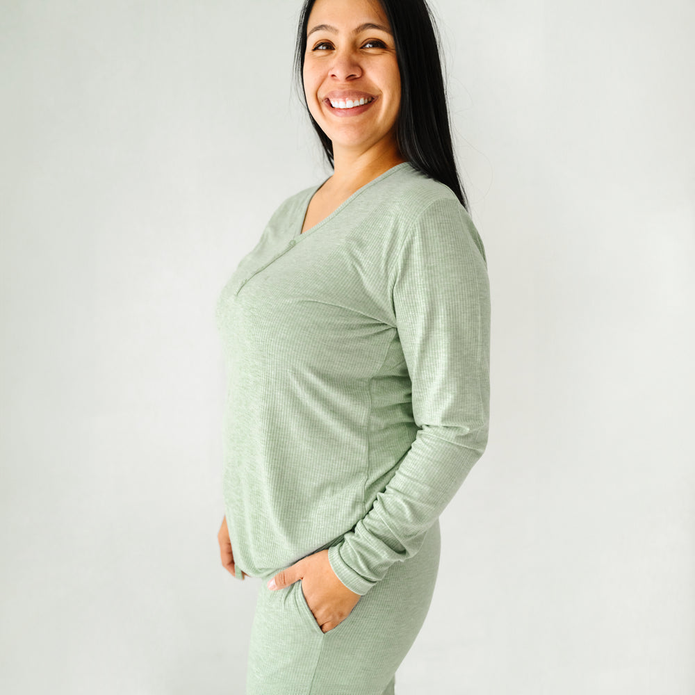 Click to see full screen - Profile view of a woman wearing Heather Sage Ribbed women's pajama top