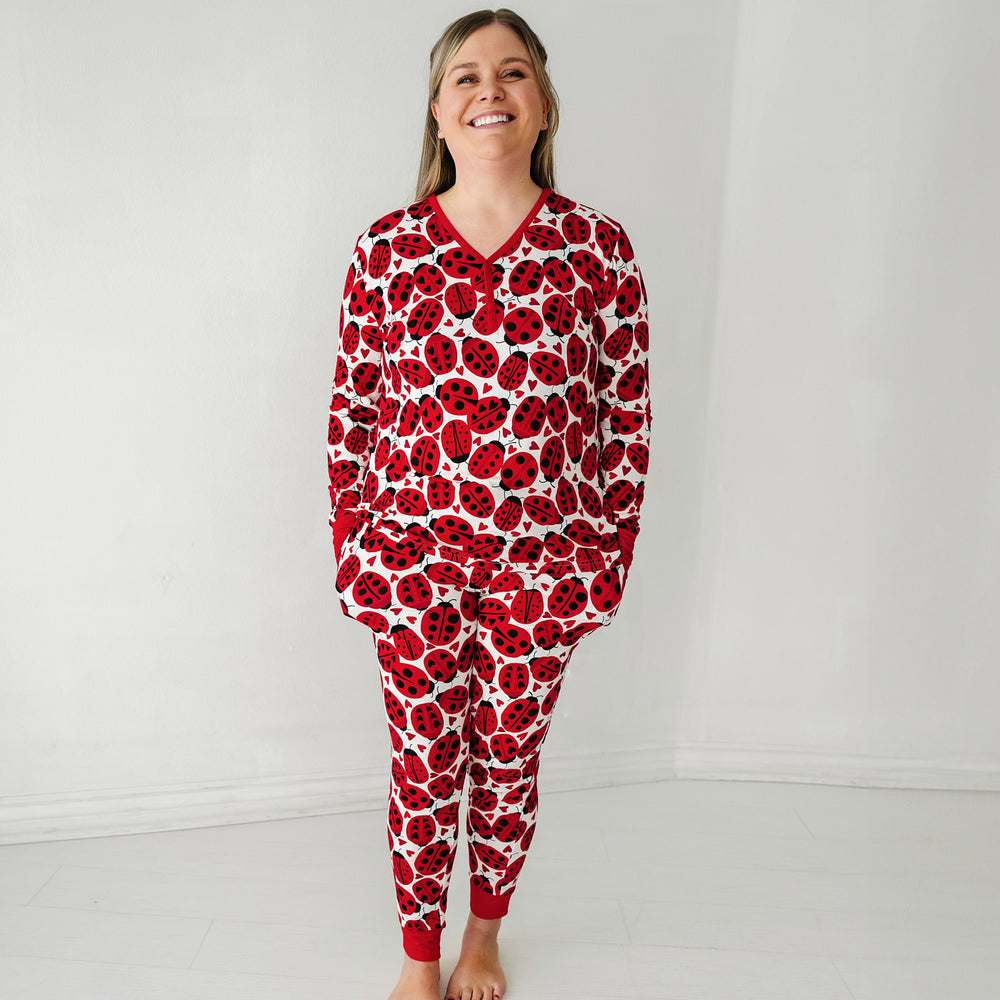 Click to see full screen - Woman wearing a Love Bug printed women's pajama top and matching pajama pants