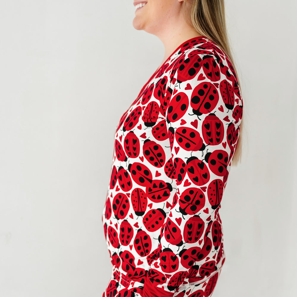 Click to see full screen - Close up side view image of a woman wearing a Love Bug printed women's pajama top
