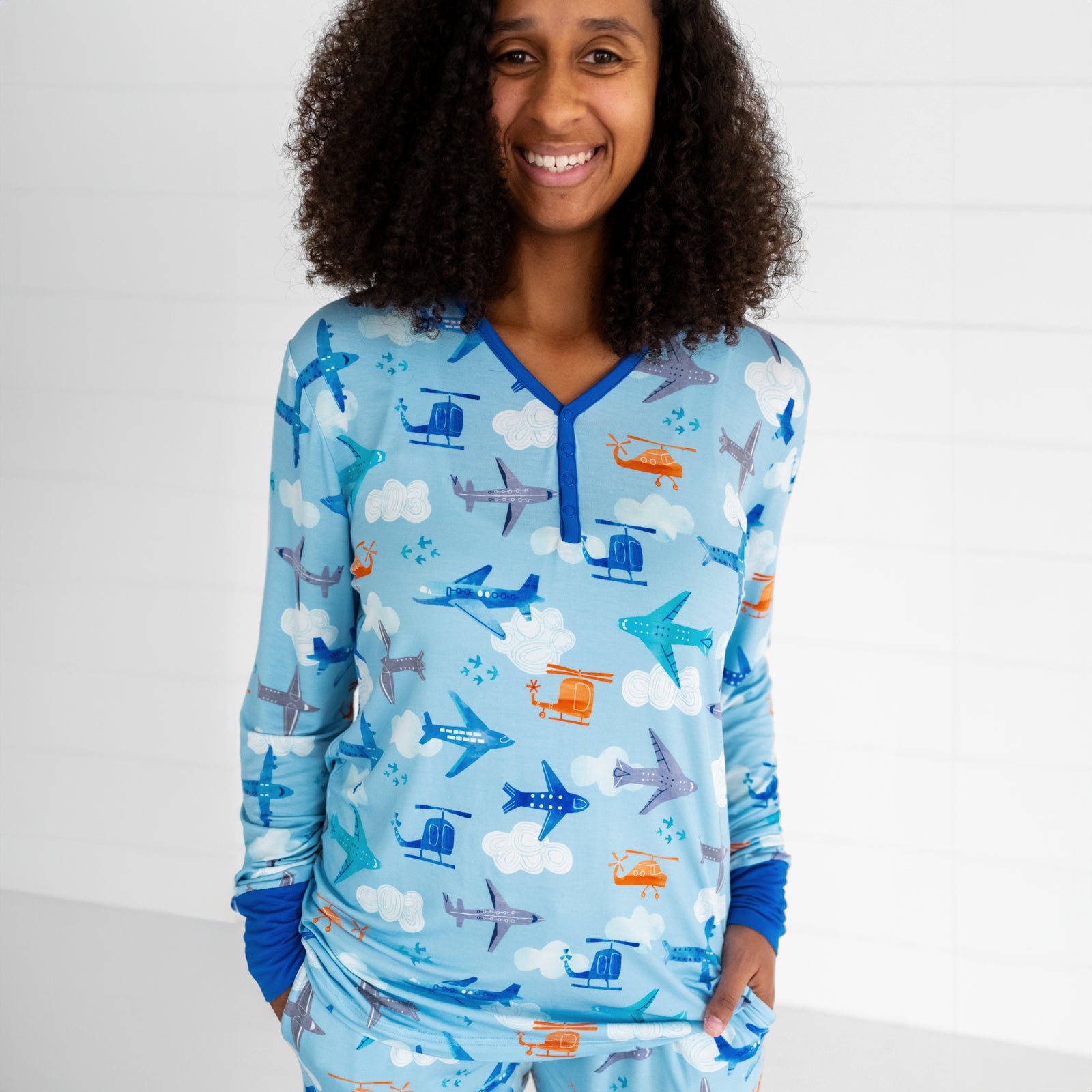 Close up image of a woman wearing a Let's Fly women's pj top