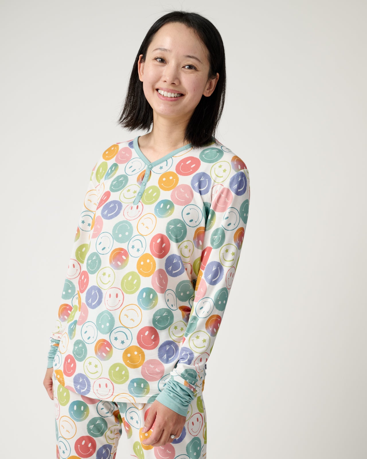 Woman wearing the Positive Vibes Women's Long Sleeve Pajama Top