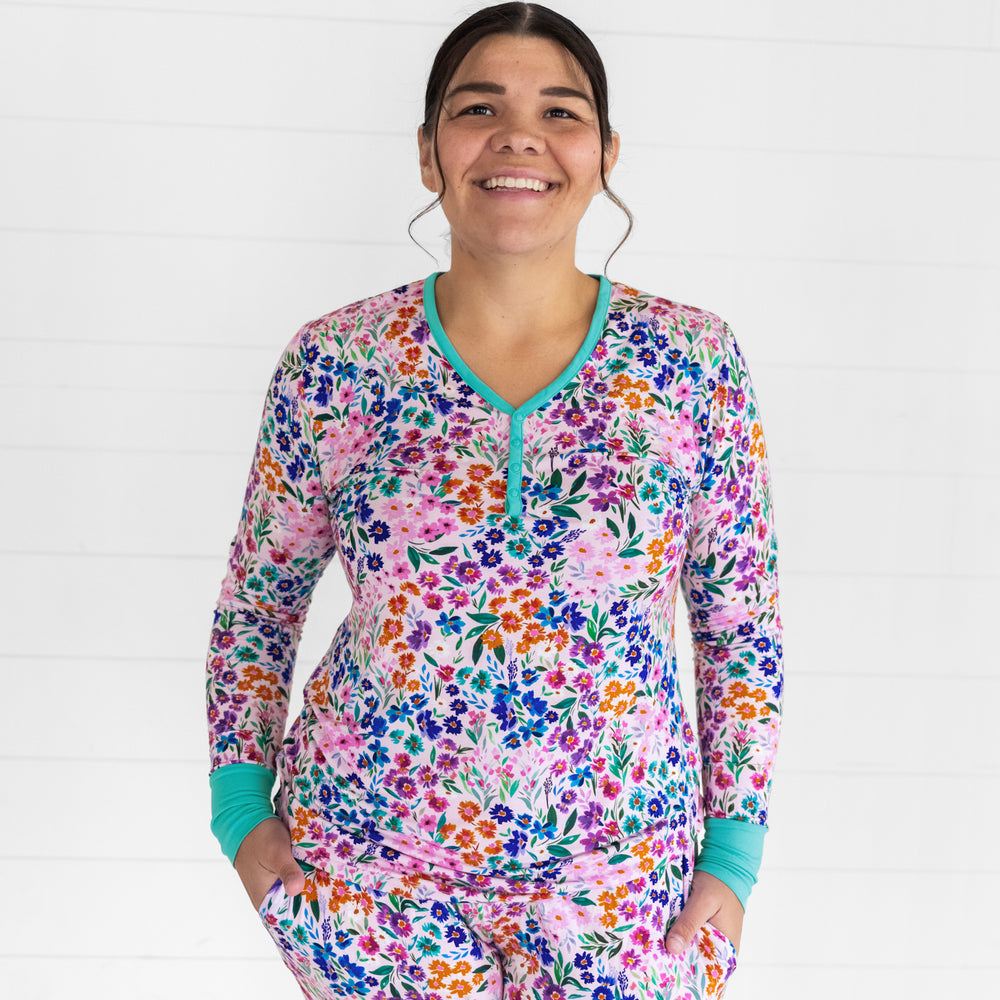 Close up image of a woman wearing a women's Sweet Pea Floral pj top