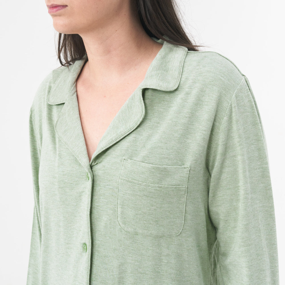 Close up picture of a woman wearing a Heather Sage women's pajama set showing the pocket detail