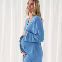 woman holding her baby bump wearing a women's Heather Blue robe