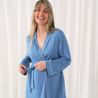 Close up image of a woman wearing a Heather Blue women's robe showing the removable tie waist