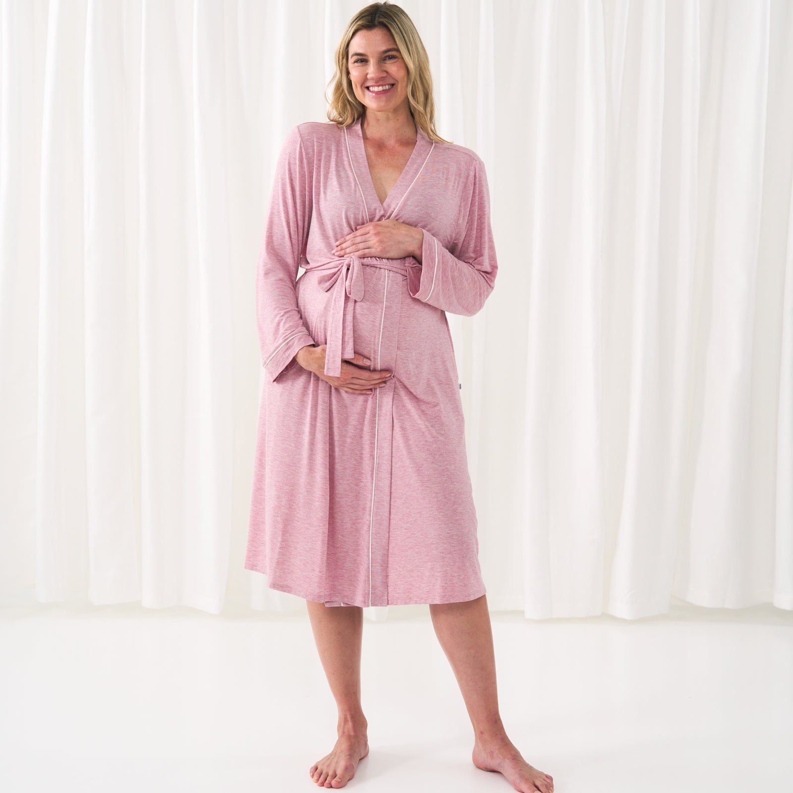 woman holding her baby bump wearing a women's Heather Mauve robe
