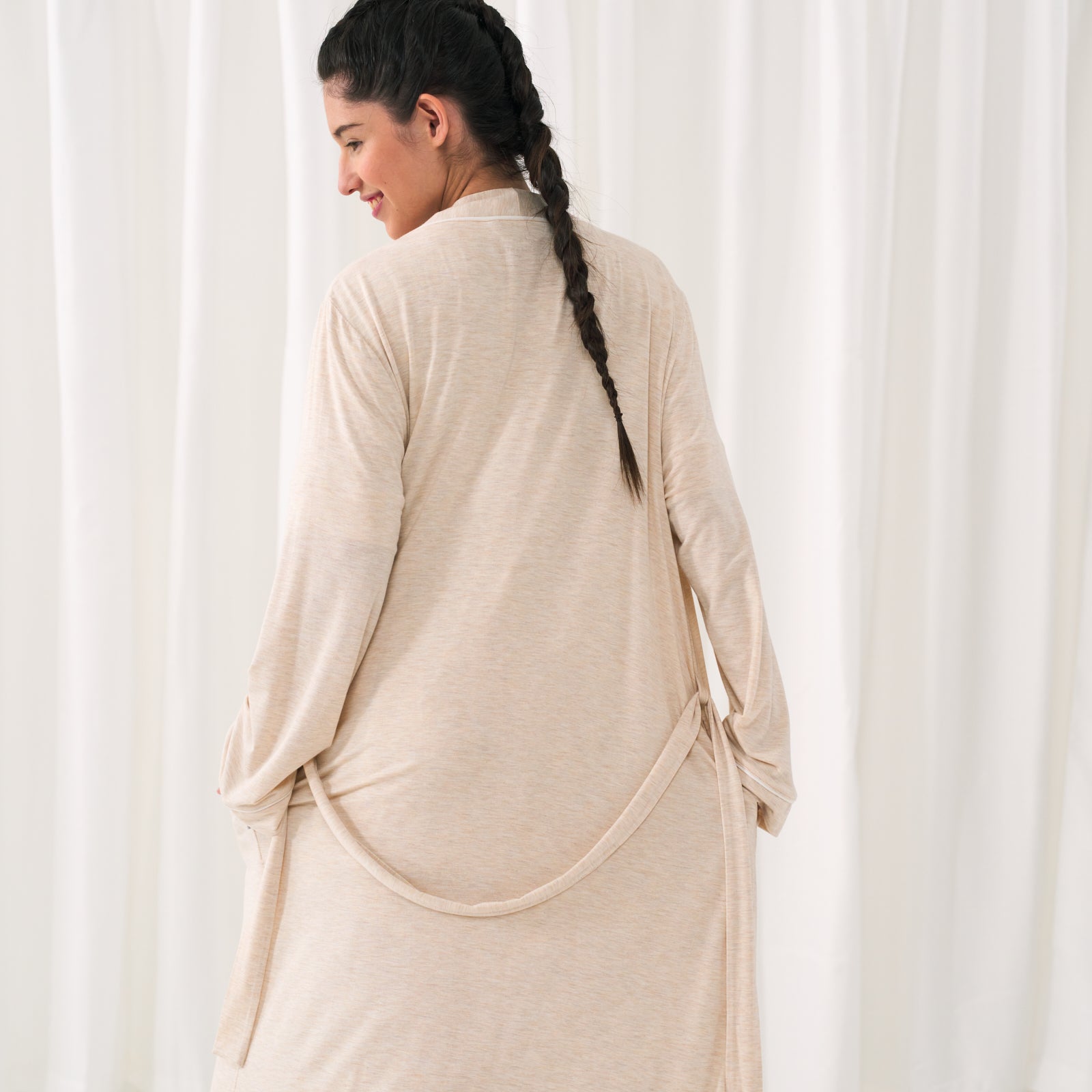 Back view of a woman wearing a Heather Oatmeal Women's Robe showing off the removable tie