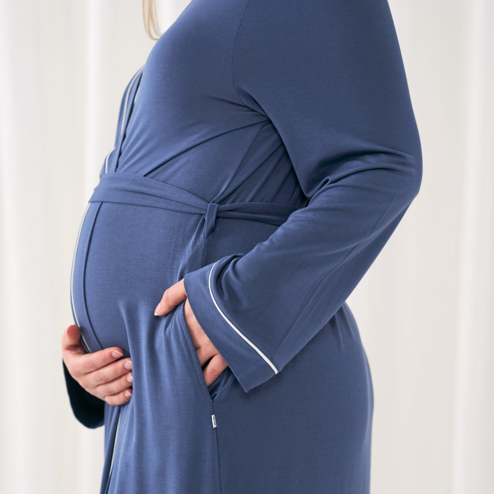 woman holding her baby bump wearing a women's Indigo robe