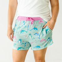 Alternate close up image of a woman wearing Dolphin Dance women's pajama shorts and coordinating top