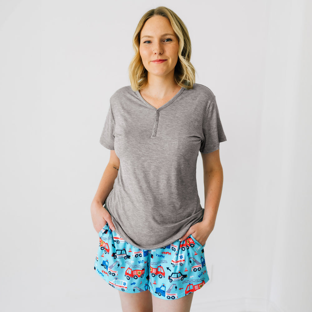 Close up image of a woman wearing To The Rescue women's pj shorts paired with a women's heather gray short sleeve pj top