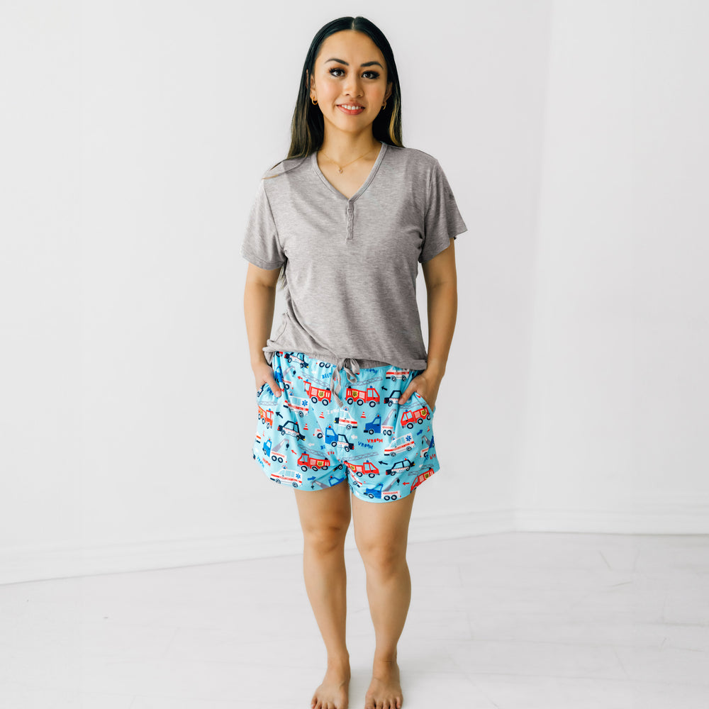 Woman wearing To The Rescue women's pj shorts paired with a women's heather gray short sleeve pj top