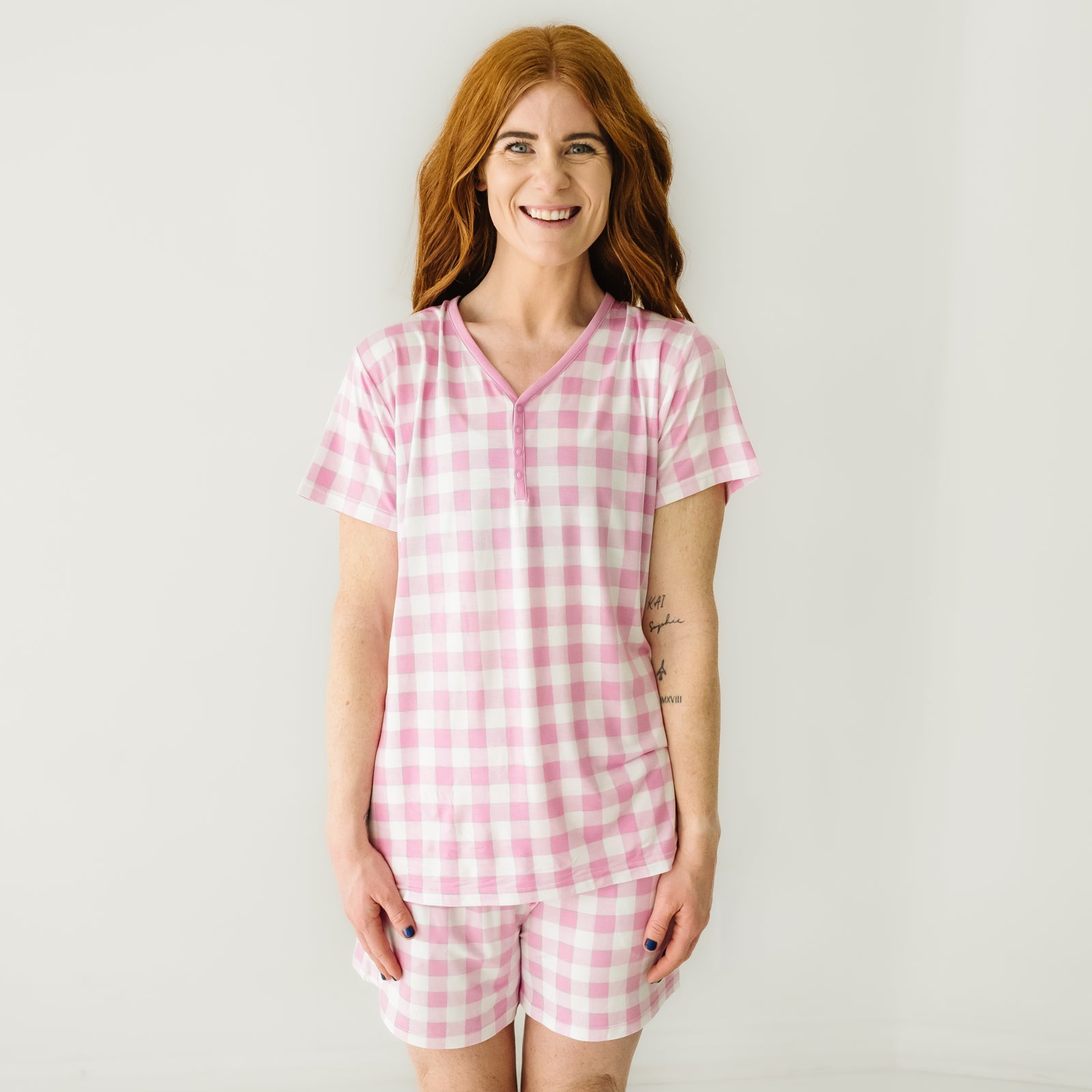 Woman wearing women's Pink Gingham pajama shorts and matching women's short sleeve pajama top