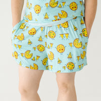 Close up image of a woman wearing Pizza Pals women's pj shorts