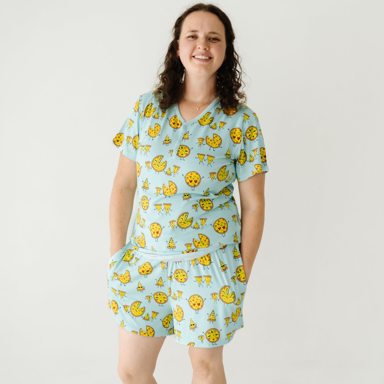 Woman wearing women's Pizza Pals women's pajama shorts and matching pj top