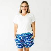 Woman wearing Rad Reef women's pajama shorts and coordinating pajama top