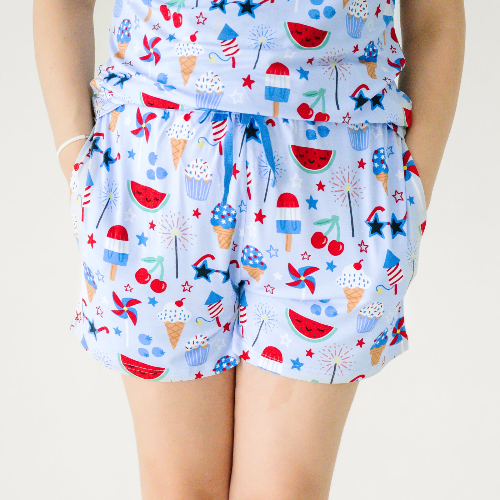 Close up image of a woman wearing Stars Stripes and Sweets women's pj shorts
