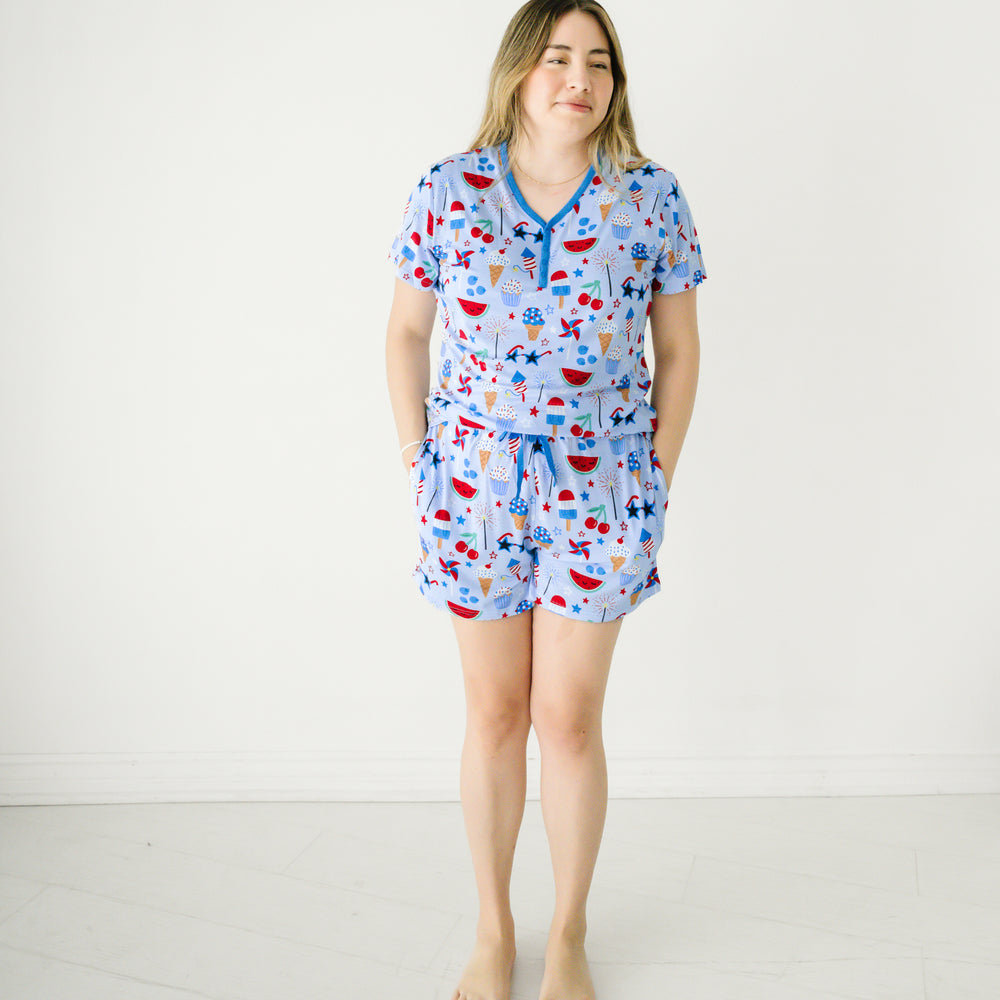 Image of a woman wearing a Stars, Stripes, and Sweets women's pj top paired with matching women's pj shorts