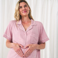 Close up image of a woman wearing a Heather Mauve women's short sleeve and shorts pajama set