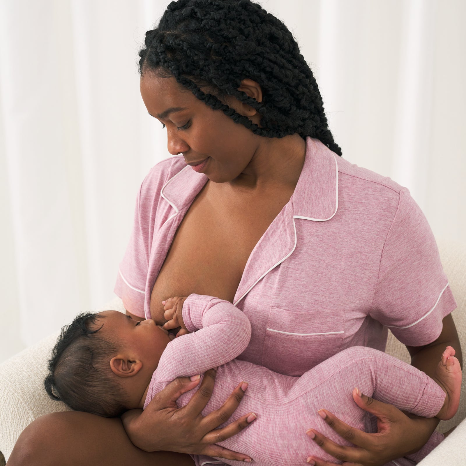 woman wearing a Heather Mauve women's short sleeve and shorts pajama set breast feeding her cild who is wearing a matching Heather Mauve zippy