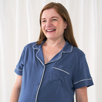 Close up image of a woman wearing an Indigo women's short sleeve and shorts pajama set